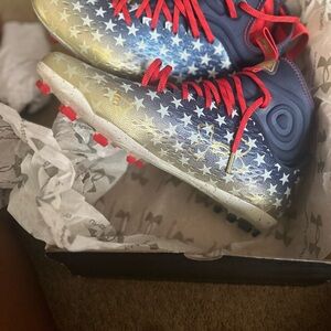 Under Armour Blue and Gold Star Cleats